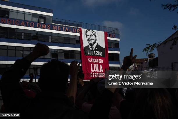 Supporters of former President Luiz Inacio Lula da Silva gather in front of the headquarters of the Metalworkers' Union while awaiting Lula's speech...