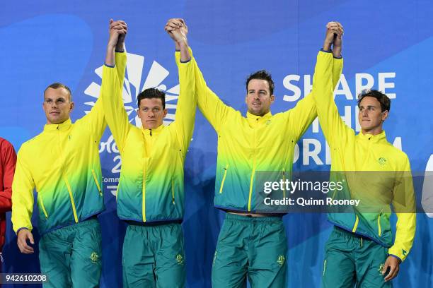 Gold medalists Cameron Mcevoy, James Magnussen, Jack Cartwright and Kyle Chalmers of Australia pose during the medal ceremony for the Men's 4 x 100m...