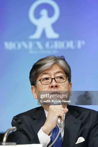 Oki Matsumoto, CEO of Monex Group Inc., speaks at a press conference in Tokyo on April 6 about a plan to acquire troubled cryptocurrency exchange...