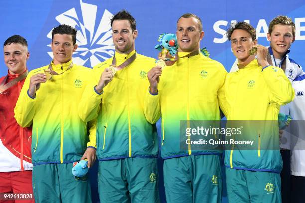 Gold medalists Cameron Mcevoy, James Magnussen, Jack Cartwright and Kyle Chalmers of Australia pose during the medal ceremony for the Men's 4 x 100m...
