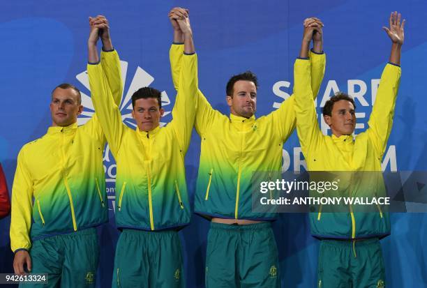 Australia's Cameron Mcevoy, James Magnussen, Jack Cartwright and Kyle Chalmers pose with their medals after the swimming men's 4x100m freestyle relay...