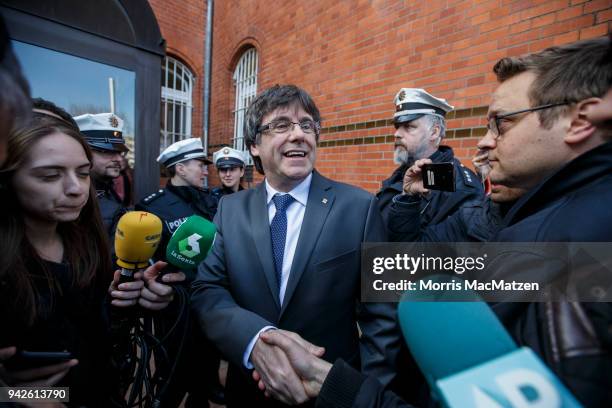 Catalan separatist leader Carles Puigdemont is guided back into the JVA after giving a statement for the assembled media just after he left the JVA...