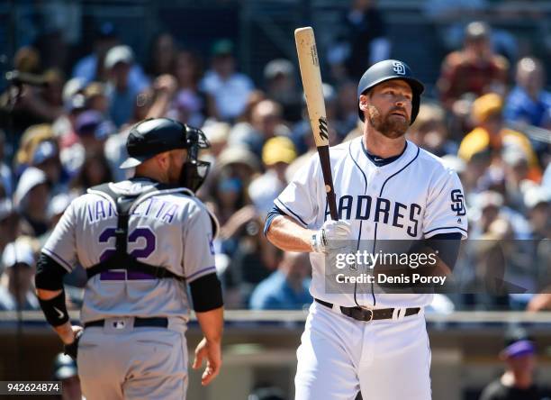 Chase Headley of the San Diego Padres reacts after a called strike out during the fifth inning of a baseball game against the Colorado Rockies at...