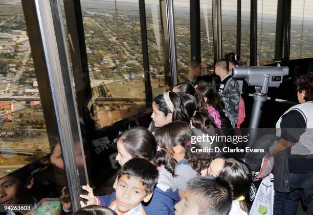 Fifth grade students from Goodwin Frazier Elementary School that won the Tony Parker Around the World Essay Contest take look out at the view from...