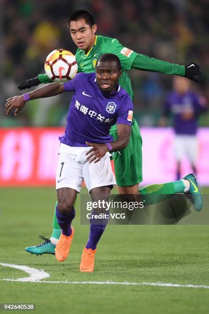 Zhang Yu of Beijing Guoan and Frank Acheampong of Tianjin Teda compete for the ball during the 2018 Chinese Super League match between Beijing Guoan...