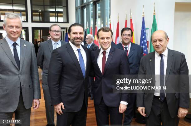 Lebanese Prime Minister Saad Hariri poses with French President Emmanuel Macron , French Economy Minister Bruno Le Maire and French Foreign Minister...