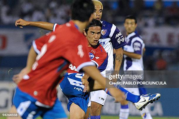 Nacional's Alvaro Gonzalez kicks the ball to score against Fenix during Uruguayan Apertura tournament football match in Montevideo on December 10,...