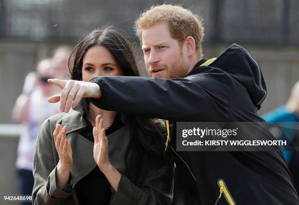 Britain's Prince Harry and his fiancee US actress Meghan Markle attend the UK team trials for the Invictus Games Sydney 2018 at the University of...