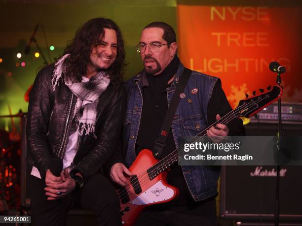 Constantine Maroulis and Mark"The Animal" Mendoza of "Twisted Sister perform during the holiday tree lighting at the New York Stock Exchange on...