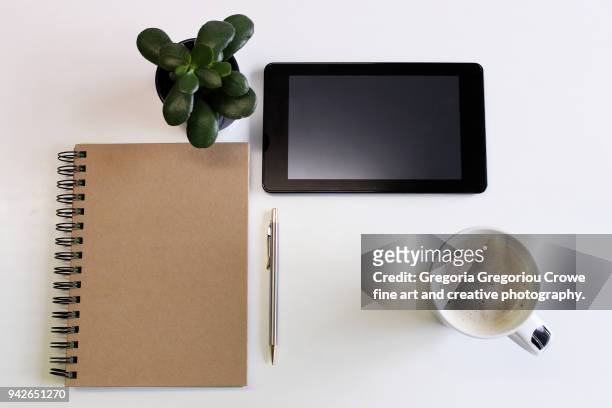 technology - tablet and notepad - gregoria gregoriou crowe fine art and creative photography stock pictures, royalty-free photos & images