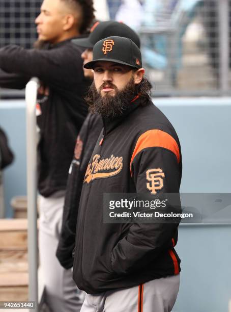 Cory Gearrin of the San Francisco Giants looks on from the dugout prior to the MLB game against the Los Angeles Dodgers at Dodger Stadium on April 1,...
