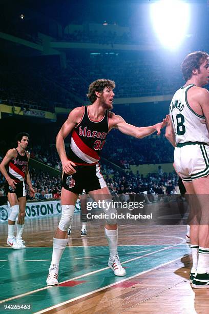 Bill Walton of the Portland Trail Blazers defends against Dave Cowens of the Boston Celtics during a game played in 1978 at the Boston Garden in...