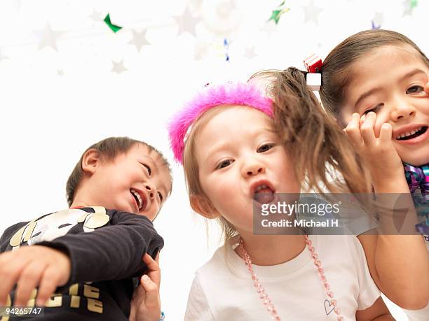 close-up of smile of children in party - smile close up stock-fotos und bilder