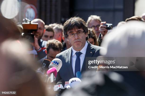 Catalan separatist leader Carles Puigdemont gives a statement for the assembled media just after he left the JVA Neumuenster prison following a court...