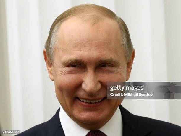 Russian President Vladimir Putin smiles during an award ceremony at the Kremlin on April 6, 2018 in Moscow, Russia. Vladimir Putin presented state...