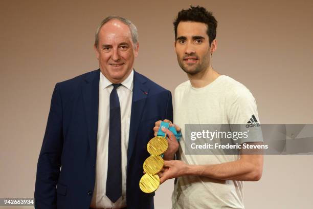 Five-time Olympic champion Martin Fourcade and CEO of MGEN Roland Berthilier attend a press conference to present the MGEN Academy on April 6, 2018...