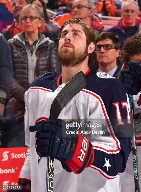 Brandon Dubinsky of the Columbus Blue Jackets stands for the singing of the national anthem prior to the game against the Edmonton Oilers on March...