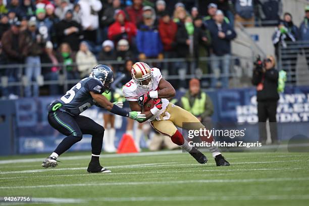 Michael Crabtree of the San Francisco 49ers makes a reception during the NFL game against the Seattle Seahawks at Qwest Field on December 6, 2009 in...