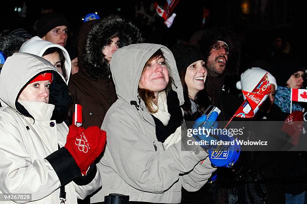 Specators gather in Place Jacques-Cartier prior to the arrival of the Vancouver 2010 Torch Relay on December 10, 2009 in Montreal, Quebec, Canada.