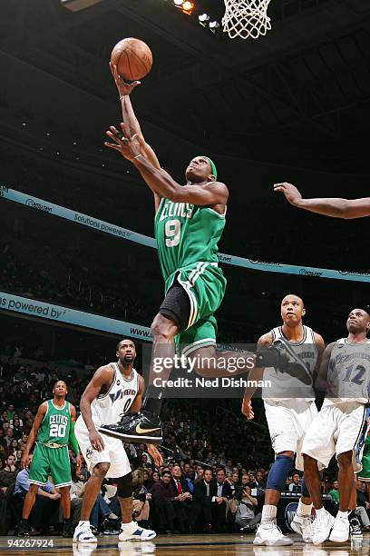 Rajon Rondo of the Boston Celtics shoots against Gilbert Arenas of the Washington WIzards at the Verizon Center on December 10, 2009 in Washington,...