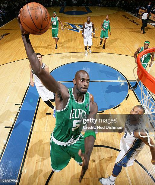 Kevin Garnett of the Boston Celtics dunks against Caron Butler of the Washington WIzards at the Verizon Center on December 10, 2009 in Washington,...
