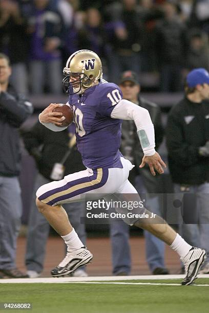 Quarterback Jake Locker of the Washington Huskies scores a touchdown in the second quarter against the California Bears on December 5, 2009 at Husky...
