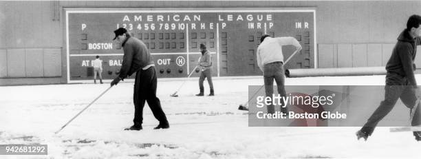 Fenway Park workers work quickly to clear snow off left field and the infield on season opener in Boston on April 8, 1985 which was this day.