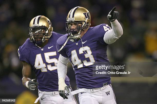 Poe of the Washington Huskies motions downfield during the game against the California Bears on December 5, 2009 at Husky Stadium in Seattle,...