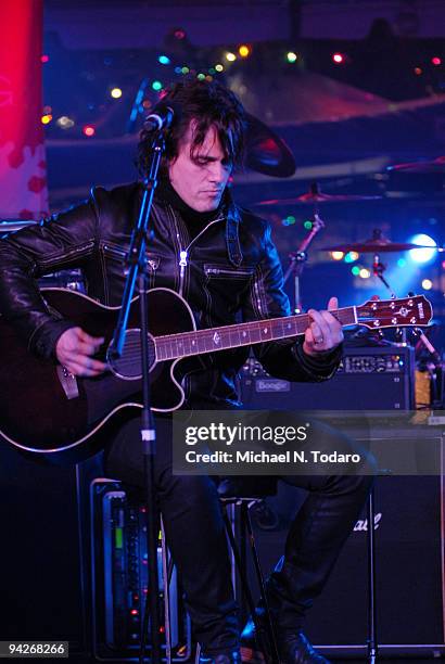 Joel Kosche of Collective Soul performs during the holiday tree lighting at the New York Stock Exchange on December 10, 2009 in New York City.