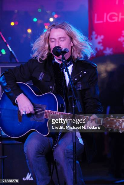 Ed Roland of Collective Soul performs during the holiday tree lighting at the New York Stock Exchange on December 10, 2009 in New York City.