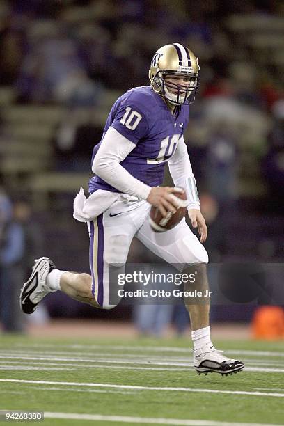 Jake Locker of the Washington Huskies runs the ball during game against the California Bears on December 5, 2009 at Husky Stadium in Seattle,...