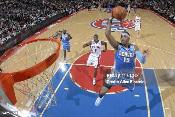 Carmelo Anthony of the Denver Nuggets goes up for a break away shot past Ben Wallace of the Detroit Pistons in a game at the Palace of Auburn Hills...