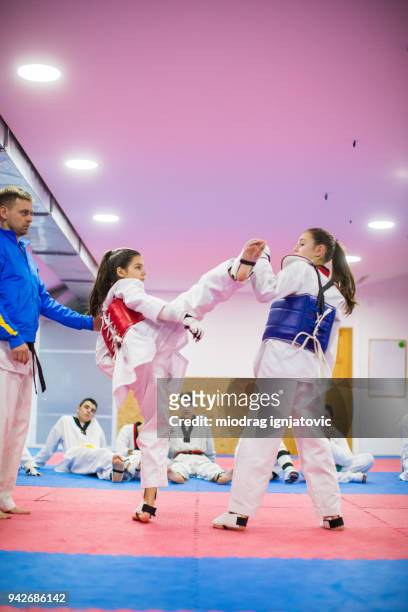 two girls fighting - kicking leg back stock pictures, royalty-free photos & images