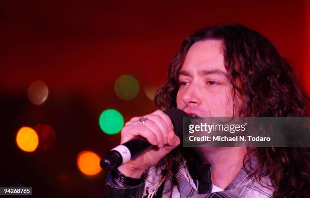 Constantine Maroulis performs during the holiday tree lighting at the New York Stock Exchange on December 10, 2009 in New York City.