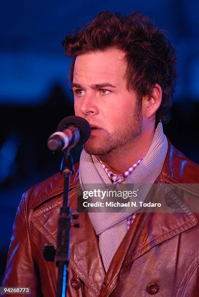 Constantine Maroulis performs during the holiday tree lighting at the New York Stock Exchange on December 10, 2009 in New York City.