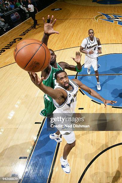 Gilbert Arenas of the Washington Wizards shoots against Kevin Garnett of the Boston Celtics at the Verizon Center on December 10, 2009 in Washington,...