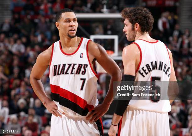 Brandon Roy and Rudy Fernandez of the Portland Trail Blazers talk on the court during the game against the New Jersey Nets at The Rose Garden on...