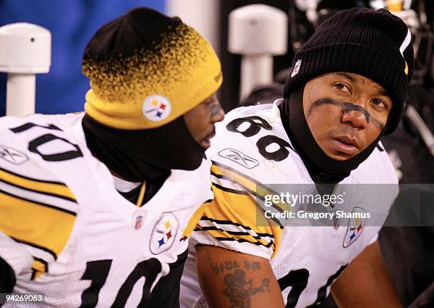 Santonio Holmes and Hines Ward of the Pittsburgh Steelers look on from the bench towards the end of their game against the Cleveland Browns at...