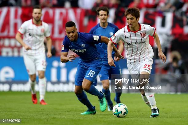 Jan Gyamerah of Bochum challenges Genki Haraguchi of Duesseldorf during the Second Bundesliga match between Fortuna Duesseldorf and VfL Bochum 1848...