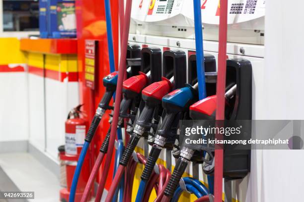 gas station and pump - benzine stock pictures, royalty-free photos & images