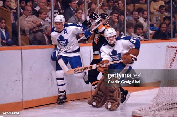 Borje Salming and Don Edwards of the Toronto Maple skate against Willy Lindstrom of the Pittsburgh Penguins during NHL game action on October 23,...