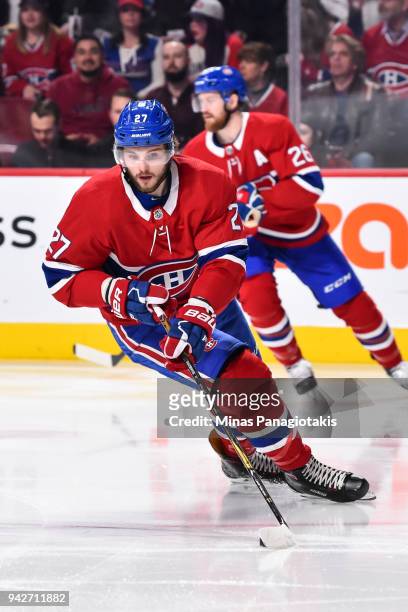 Alex Galchenyuk of the Montreal Canadiens skates the puck against the Winnipeg Jets during the NHL game at the Bell Centre on April 3, 2018 in...
