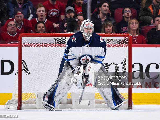 Goaltender Steve Mason of the Winnipeg Jets looks on as he protects his net against the Montreal Canadiens during the NHL game at the Bell Centre on...