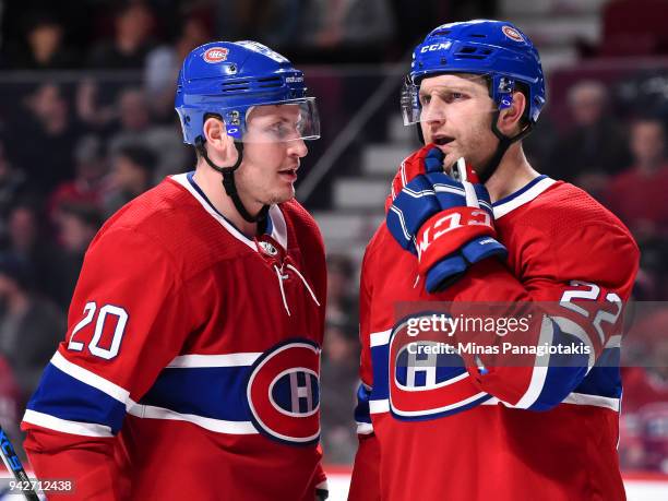 Nicolas Deslauriers of the Montreal Canadiens speaks with teammate Karl Alzner against the Winnipeg Jets during the NHL game at the Bell Centre on...