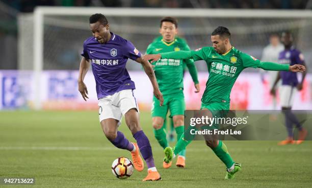 Viera of Beijing Guoan and John Obi Mikel of Tianjin Teda in action during the 2018 Chinese Super League match between Beijing Guoan and Tianjin Teda...