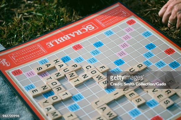 Close-up of Milton Bradley Scrabble gameboard in a grassy, park setting, Lafayette, California, 2018.
