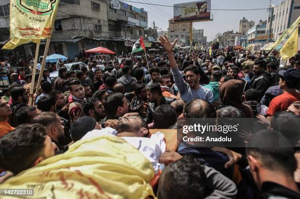 Palestinians carry the body of Sair Muhaamed Rabia , who was martyred by Israeli soldiers during "Great March of Return" near Gaza-Israel border,...