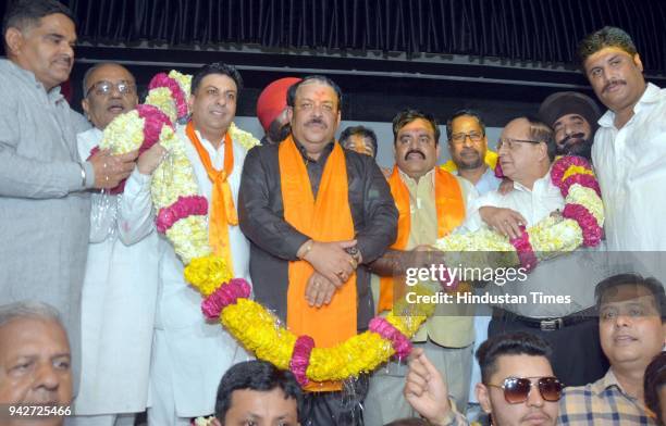 Newly appointed Bharatiya Janata Party Punjab president and Rajya Sabha MP Shwait Malik being garlanded by the district president Rajesh Honey , BJP...