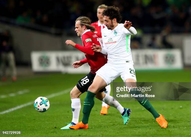 Iver Fossum of Hannover and Ishak Belfodil of Bremen battle for the ball during the Bundesliga match between Hannover 96 and SV Werder Bremen at...
