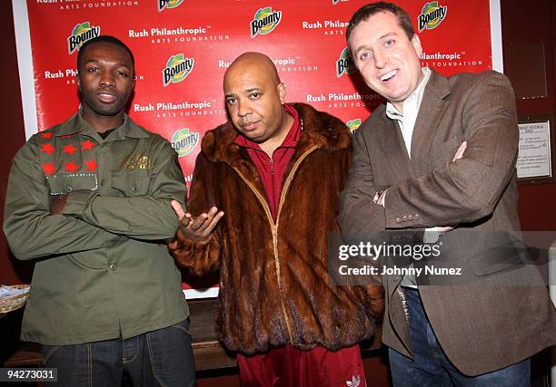 Jamie Hector, Joseph "Rev Run" Simmons, and Chris Brown attend the 10th annual Rush Philanthropic Arts Foundation youth holiday party at The Fillmore...